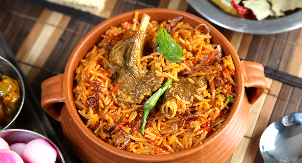  MUTTON BIRYANI (SERVED WITH RAITA) 